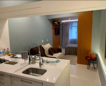a kitchen with a couch and a sink