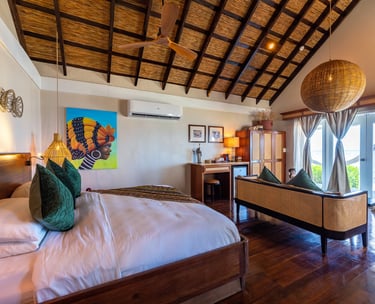 a bedroom with a bed and a couch