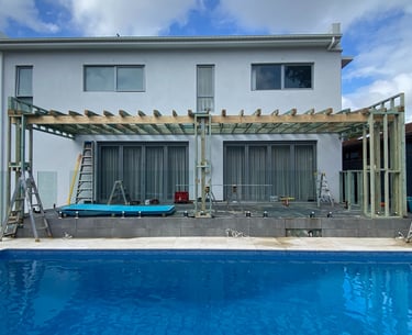 foreground pool with modern home extention in progress