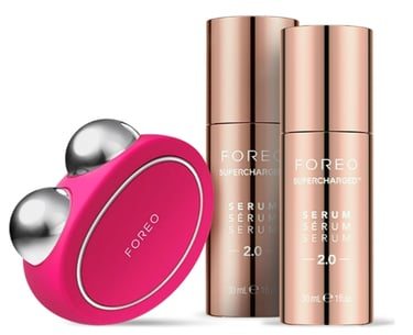 age defying facial device bundle with one pink device and two bottles of treatment