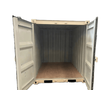 Open beige steel shipping container with a plywood floor for storage and transport.