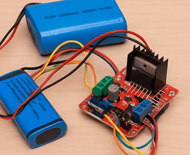 Lithium batteries and L298N motor driver module wired for powering an Arduino-based robot