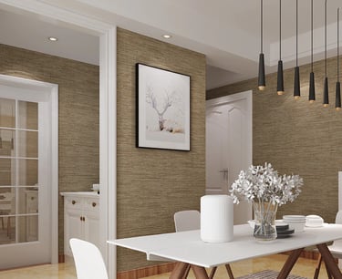 Modern dining room with brown textured wallpaper, white table, and black pendant lights.