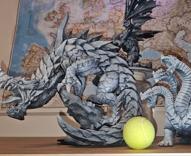 a tennis ball and a dragon on a table