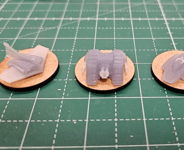 a pair of small plastic toy cars on a table