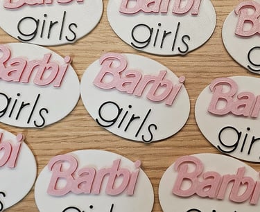 a number of baby shower signs on a table
