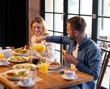 sugar dating: a sugar baby and sugar mommy sitting at a table with food