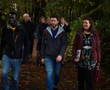 a team walking in the forest with Dorchess from Awe Academy