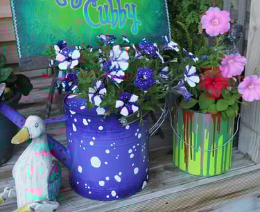 decorative painted tin and watering can