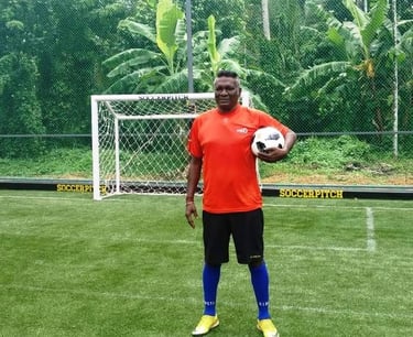 Legendry footballer I M vijayan at Green synthetic football ground with net fencing in edappally