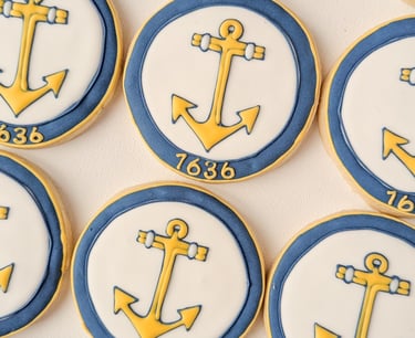 RI Secretary of State anchor logo on a cookie in yellow, white, and blue
