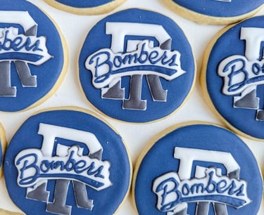Cookies with CLCF Bombers logo in blue, gray, and white
