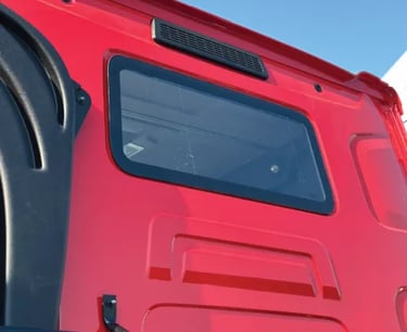 small window of the red truck
