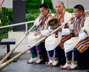 bhutanese-men-using-their-local-version-trumpet-at-the-masked-dance-festival-in-the-capital-Thimphu