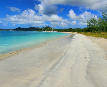 Valley Church Beach Antigua – long stretch of white sand with palm trees and turquoise water