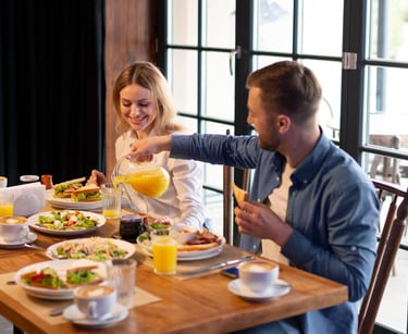 sugar dating: a sugar baby and sugar mommy sitting at a table with food