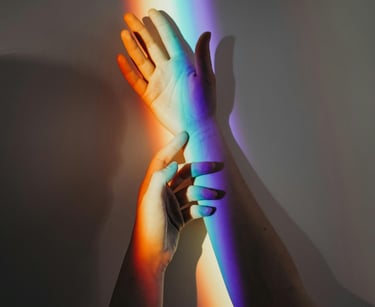 Different colours of light reflected on a hand