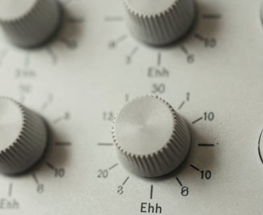 Close-up macro shot of high-end analog audio dials, soft diffused lighting, precise mathematical typography on the dials, muted slate tones, 35mm film.