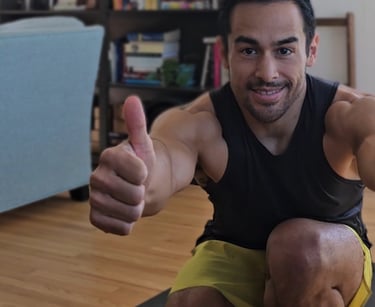 Man in pistol squat giving a thumbs up