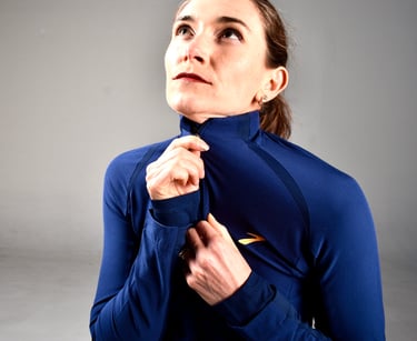 coach Nora zipping up running jacket