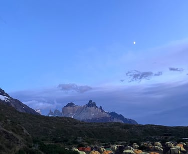 A tent pitched up in Paine Grande campsite with Cerro Cuerno Principal