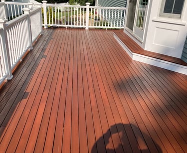 Deck staining and refinishing in Scituate, MA. completed by Michael Cummings Painting
