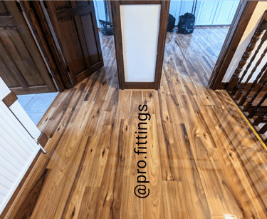 Gloss laminate flooring fitted in Stratford by Pro Fittings Ltd
