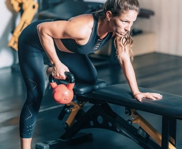 a woman using a kettlebell