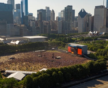 a large crowd of people standing in front of a large building