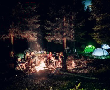 a group around a campfire. Summer camp.Vacation Rental Consulting with Timea Pokol Consultant