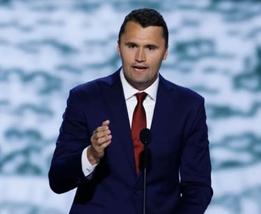 a man in a suit and tie is giving a speech