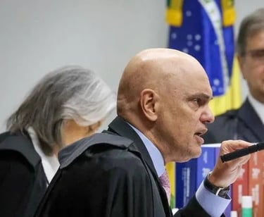 a man in a suit and tie is speaking into a microphone