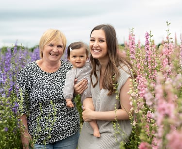 Candid family photo showing 3 generations. Captured by Surrey Family photographer Lauren Gazzard. 