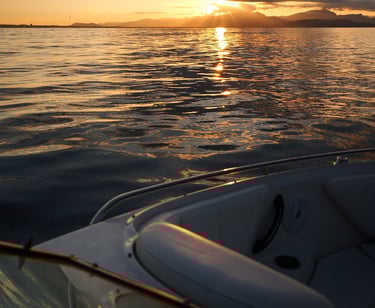 Sunset view from a boat in Alcudia Port during a Private Tour