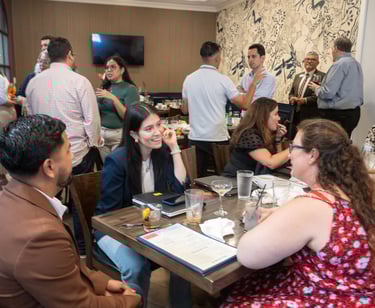 Jenny Silva chats with classmates at Hispanic Austin Leadership event