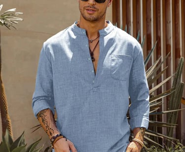 a man in a sky blue shirt and white pants