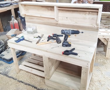 a mud kitchen being made with tools on it