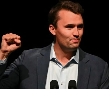 a man in a suit and tie is holding a microphone