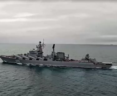 a large ship in the water with a boat in the water