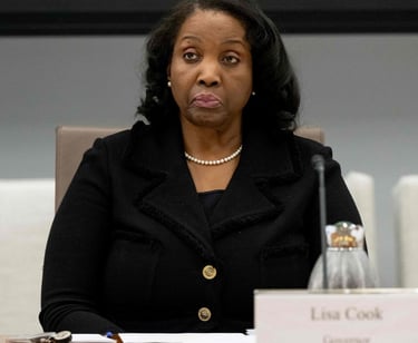 a woman in a black jacket and pearls necklaces