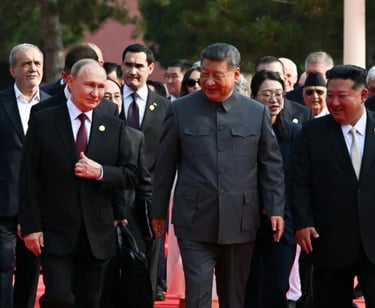 a group of men in suits and ties walking down a red carpet