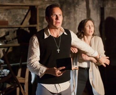 a man and woman standing in a room