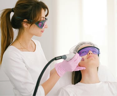 woman with co2 laser on client's face