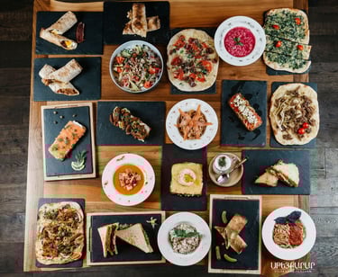 Table filled with numerous Armenian dishes at Steakarar.