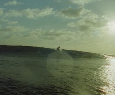 a surfer is riding a wave in the ocean
