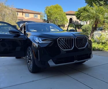 BMW X3 recently delivered to a client's driveway