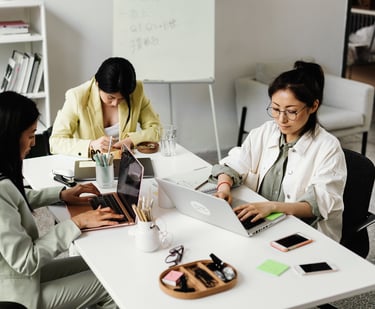 a group of people sitting around a table