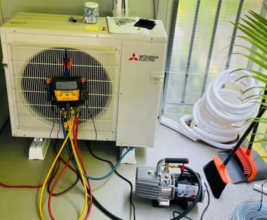 Engineer doing annual maintenance checks and readings on an Ac System on a balcony