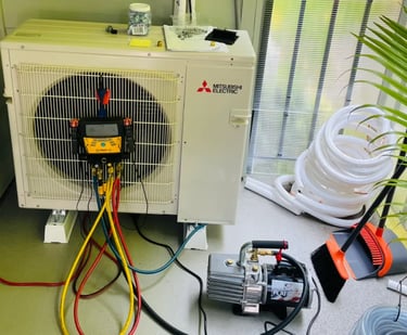 Engineer doing annual maintenance checks and readings on an Ac System on a balcony