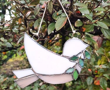 les rameaux, vitrail oiseau avec branche de rameaux